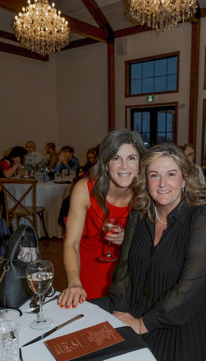 Two women at a formal dinner