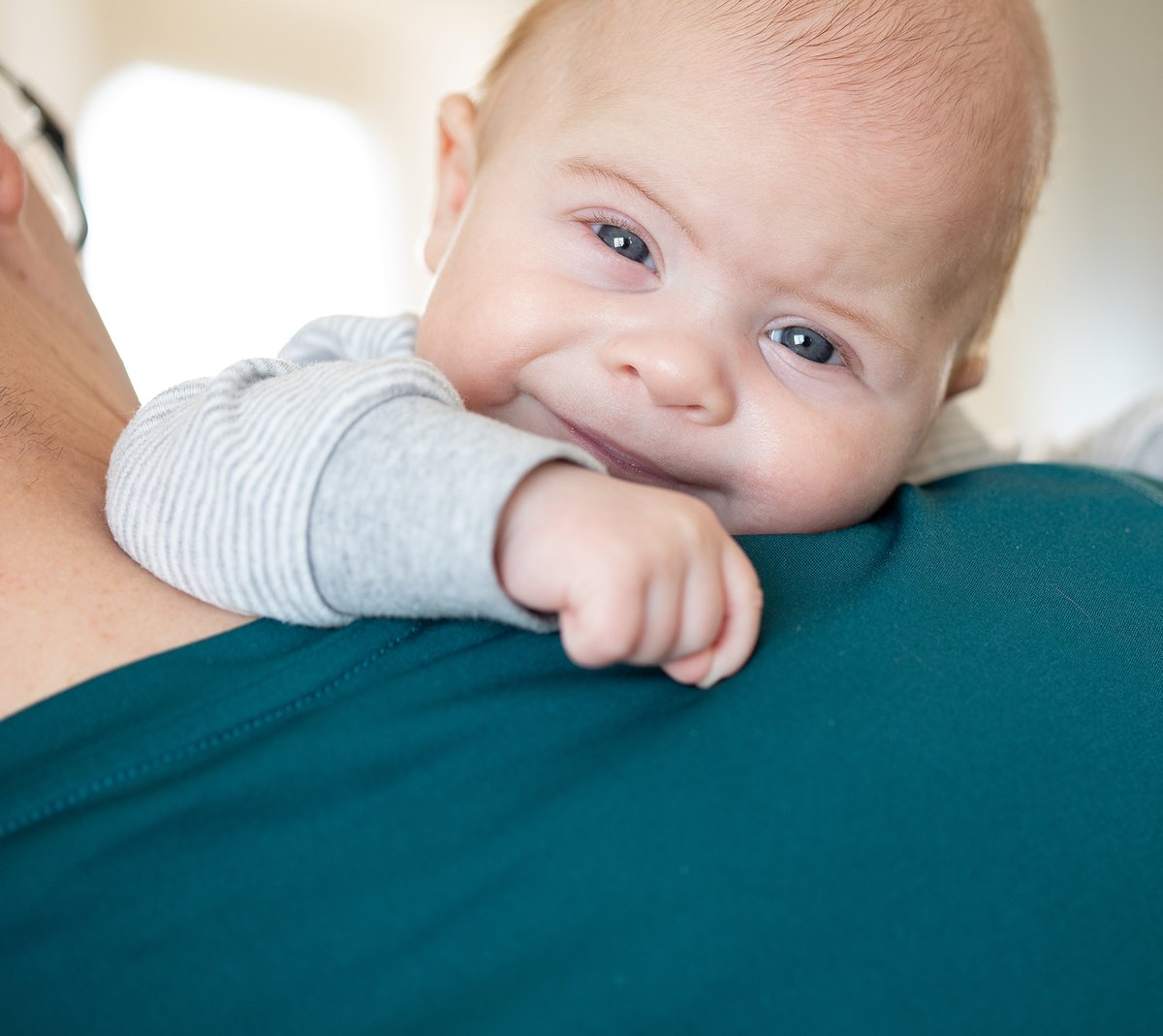 Baby resting on a parent's shoulder